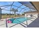 Screened, refreshing pool with inflatable flamingos at 413 San Ambrosio St, Punta Gorda, FL 33983