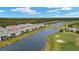 Wide aerial view of townhome and golf course at 43306 Water Bird Way # 6622, Punta Gorda, FL 33982