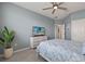 Bedroom with TV, dresser, and leafy plant at 43306 Water Bird Way # 6622, Punta Gorda, FL 33982