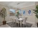 Elegant dining room with a large table and chic lighting at 43306 Water Bird Way # 6622, Punta Gorda, FL 33982