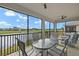 Enjoy this spacious patio view, overlooking a serene lake and golf course at 43306 Water Bird Way # 6622, Punta Gorda, FL 33982