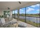 Screened patio overlooking a lake and golf course at 43306 Water Bird Way # 6622, Punta Gorda, FL 33982