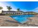 Rectangular pool with surrounding lounge chairs at 43306 Water Bird Way # 6622, Punta Gorda, FL 33982