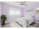 Bedroom with a queen-size bed and light purple walls at 4338 Shappell St, Port Charlotte, FL 33948