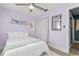 Bedroom with a full-size bed and light purple walls at 4338 Shappell St, Port Charlotte, FL 33948