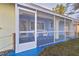 Inviting screened-in front porch with comfy seating at 4338 Shappell St, Port Charlotte, FL 33948