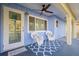 Front porch with ceiling fan and wicker chairs at 4338 Shappell St, Port Charlotte, FL 33948