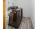 Bright laundry room, featuring a washer and dryer, and a laundry basket at 4338 Shappell St, Port Charlotte, FL 33948