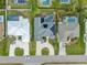 Aerial view showing three homes with pools and solar panels at 474 Orlando Blvd, Port Charlotte, FL 33954