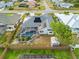 Aerial view of home with pool, solar panels, and fenced backyard at 474 Orlando Blvd, Port Charlotte, FL 33954