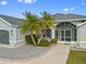 Front entrance of home with landscaping at 474 Orlando Blvd, Port Charlotte, FL 33954