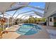 Inviting kidney-shaped pool with screened enclosure at 474 Orlando Blvd, Port Charlotte, FL 33954