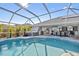 Large, refreshing pool with screened enclosure and spa at 474 Orlando Blvd, Port Charlotte, FL 33954