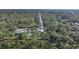 Aerial view of home and surrounding lush landscape at 489 & 497 Campbell St, Port Charlotte, FL 33953