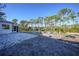 Landscaped backyard with gravel and a pergola at 489 & 497 Campbell St, Port Charlotte, FL 33953