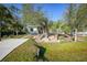 Modern home with paved driveway and landscaped front yard at 489 & 497 Campbell St, Port Charlotte, FL 33953