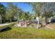 Landscaped front yard with tropical plants and a modern home at 489 & 497 Campbell St, Port Charlotte, FL 33953