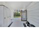 Private outdoor shower with wood frame and gray tile floor at 489 & 497 Campbell St, Port Charlotte, FL 33953