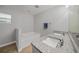 Bathroom boasts granite countertops and a bathtub at 4959 Cromey Rd, North Port, FL 34288