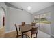 Dining area with sliding glass doors leading to patio at 4959 Cromey Rd, North Port, FL 34288