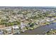 Aerial view showcasing waterfront homes and neighborhood at 498 E Tarpon Nw Blvd, Port Charlotte, FL 33952