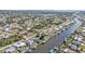 Wide aerial view of waterfront homes and neighborhood at 498 E Tarpon Nw Blvd, Port Charlotte, FL 33952