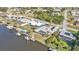 Aerial view of canal-front property with dock and boats at 498 E Tarpon Nw Blvd, Port Charlotte, FL 33952