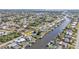 Wide aerial view showcasing the property's canal-side location at 498 E Tarpon Nw Blvd, Port Charlotte, FL 33952