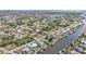 Aerial view of canal-front property and neighborhood at 498 E Tarpon Nw Blvd, Port Charlotte, FL 33952