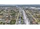 Aerial view of waterfront community with many houses and a canal at 498 E Tarpon Nw Blvd, Port Charlotte, FL 33952