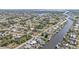 Aerial view of canal-front home and surrounding area at 498 E Tarpon Nw Blvd, Port Charlotte, FL 33952