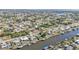 Aerial view of canal-side homes and lush landscape at 498 E Tarpon Nw Blvd, Port Charlotte, FL 33952