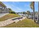 Brick paved walkway leads to a relaxing patio overlooking the canal at 498 E Tarpon Nw Blvd, Port Charlotte, FL 33952