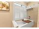 Relaxing bathroom with soaking tub and window at 498 E Tarpon Nw Blvd, Port Charlotte, FL 33952