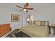 Guest bedroom with ceiling fan and dresser at 498 E Tarpon Nw Blvd, Port Charlotte, FL 33952