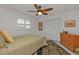 Cozy bedroom with ceiling fan and built-in closet at 498 E Tarpon Nw Blvd, Port Charlotte, FL 33952