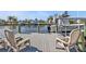 Spacious dock with two chairs, offering beautiful water views at 498 E Tarpon Nw Blvd, Port Charlotte, FL 33952