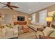 Living room featuring a curved sofa and a mid-century modern aesthetic at 498 E Tarpon Nw Blvd, Port Charlotte, FL 33952