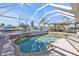 Enclosed pool and patio area with water feature at 498 E Tarpon Nw Blvd, Port Charlotte, FL 33952