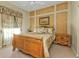 Bedroom with a wooden bed frame and decorative wall at 5189 Collingswood Blvd, Port Charlotte, FL 33948