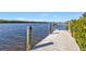 Wooden dock with water access, perfect for relaxing at 5189 Collingswood Blvd, Port Charlotte, FL 33948