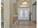 Elegant entryway with double doors and tiled flooring at 5189 Collingswood Blvd, Port Charlotte, FL 33948