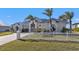 Single-story home with metal roof and white picket fence at 5189 Collingswood Blvd, Port Charlotte, FL 33948