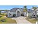 Single-story home with metal roof and white picket fence at 5189 Collingswood Blvd, Port Charlotte, FL 33948