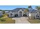 Single-story home with metal roof and white picket fence at 5189 Collingswood Blvd, Port Charlotte, FL 33948