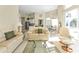 Open floor plan Gathering room with leather sofas and glass-top coffee table at 5189 Collingswood Blvd, Port Charlotte, FL 33948