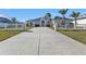 Lovely home with a long driveway and white fence at 5189 Collingswood Blvd, Port Charlotte, FL 33948