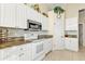 Bright kitchen with granite countertops and white cabinets at 5189 Collingswood Blvd, Port Charlotte, FL 33948