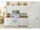 Kitchen with white cabinets, granite countertops, and stainless steel appliances at 5189 Collingswood Blvd, Port Charlotte, FL 33948