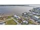 Aerial view shows waterfront homes with boat docks in a neighborhood by a wide waterway at 5194 Fleming St, Port Charlotte, FL 33981